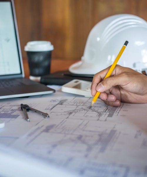 Construction engineering or architect hands working on blueprint inspection in workplace